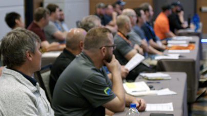 Maintenance and reliability professionals attending a classroom learning session at a Reliable Plant conference.